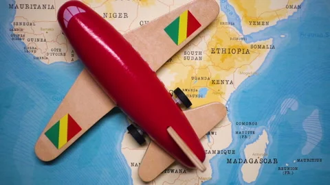 A plane with a flag of Republic of the Congo crossing the map. Stock Footage 143982617