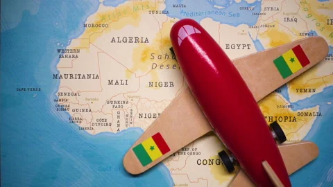 A plane with a flag of Senegal crossing the map. Stock Footage 143982728