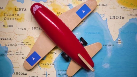 A plane with a flag of Somalia crossing the map. Stock Footage 143982735