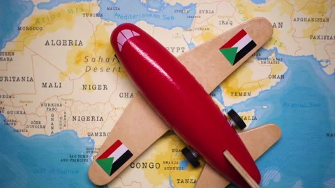 A plane with a flag of Sudan crossing the map. Stock Footage 143982842