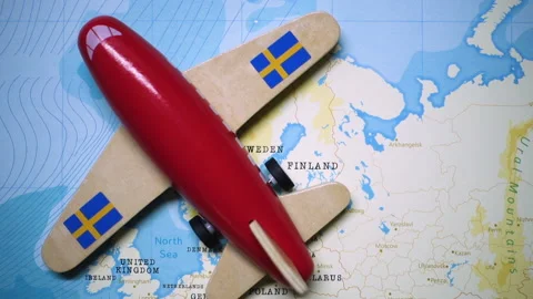 A plane with a flag of Sweden crossing the map. Stock Footage 143983935