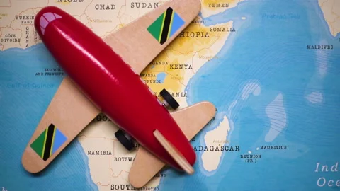 A plane with a flag of Tanzania crossing the map. Stock Footage 143982960