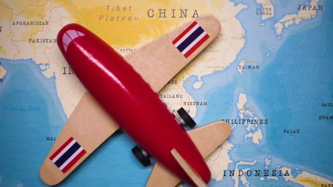 A plane with a flag of Thailand crossing the map. Stock Footage 143983004