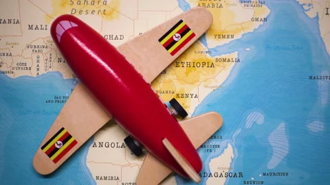 A plane with a flag of Uganda crossing the map. Stock Footage 143983047