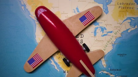 A plane with a flag of USA crossing the map. Stock Footage