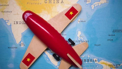 A plane with a flag of Vietnam crossing the map. Stock Footage 143983402