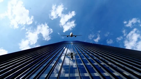 The plane flew over the rooftops of the city's financial buildings Stock Footage 336365418