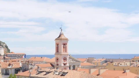 A plane flies above the skyline of Nice, France Stock-Footage 112004740