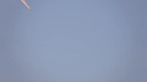 The plane flies across the sky and leaves a thick track after himself. Stock Footage 167178618