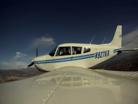 The plane flies against a background of clouds Stock Footage 59111538
