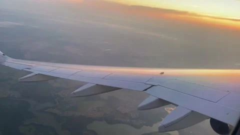 The plane flies and turns aligns at sunset Stock Footage 158746790