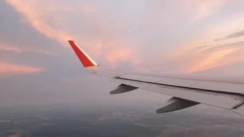 The plane flies and turns aligns at sunset Stock Footage 158822990