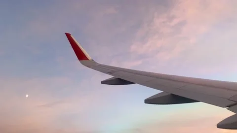 The plane flies and turns aligns at sunset Stock Footage 158865189
