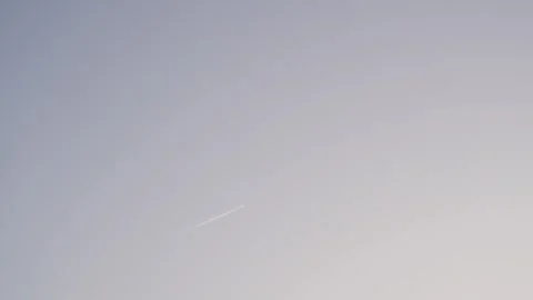 The plane flies in the blue sky Stock Footage 329092547