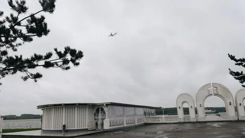 The plane flies in the clouds low above the ground. Cloudy weather. Stock Footage 120491066