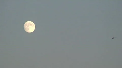 Plane Flies in Front of Moon Stock-Footage 288552