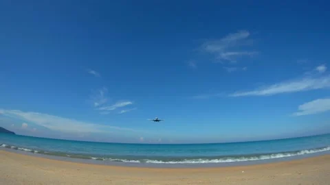 The plane flies low over the beach Stock Footage 155276321