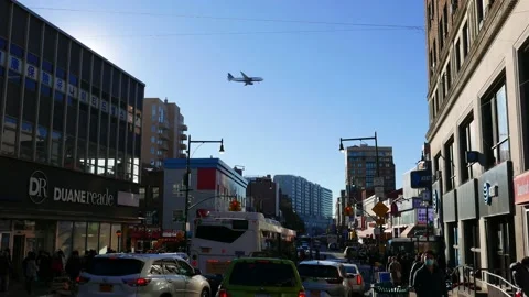 Plane flies low over Flushing, Queens, NYC to land at LaGuardia Airport Stock Footage 222454905