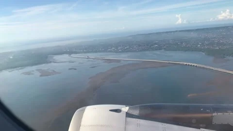 The plane flies low over the ground view from the window Stock Footage 169774123