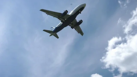 Plane flies low preparing for landing Stock Footage 109277120