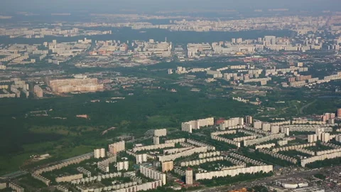 Plane flies over the city Stock Footage 166628796