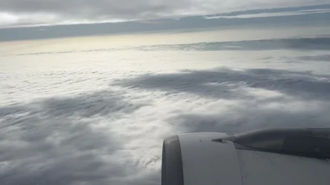 A plane flies over the clouds Stock Footage 313220416