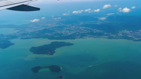 The plane flies over the coast Video stock 157522103