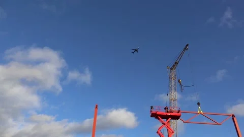 Plane flies over the construction site. Vídeos de archivo 231861939