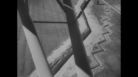 Plane flies over defensive structure, Vichy troops round up members of the Stock Footage 103390534