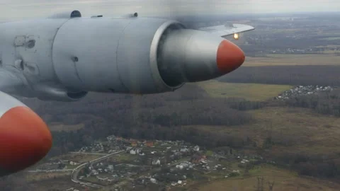 The plane flies over fields and forest. View from the porthole. Video stock 145235205
