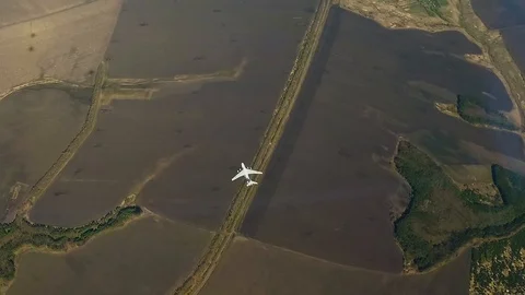 The plane flies over the fields Stock Footage 89651109