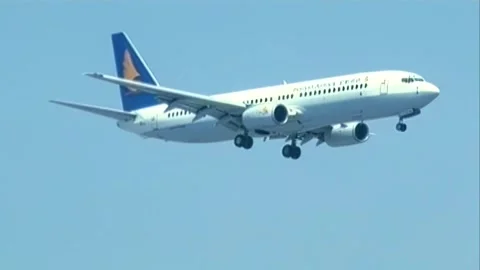 Plane flies over Stock Footage 253772773