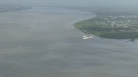 Plane flies over Georgetown, Guyana Stock Footage 519768