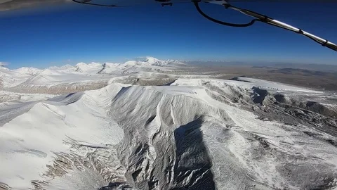 The plane flies over the Himalayan mountains Stock Footage 106666026