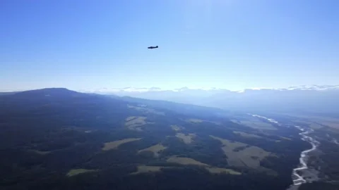 The plane flies over a mountainous area Stock Footage 171288353