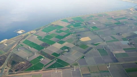 The plane flies over Netherlands on approaching the Amsterdam Video stock 74478557