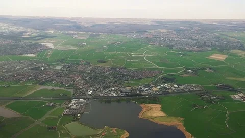 The plane flies over Netherlands on approaching the Amsterdam 스톡 동영상 74478667