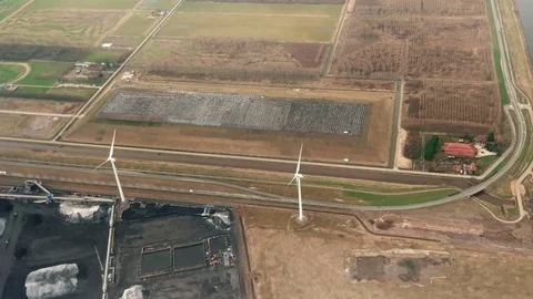 The plane flies over Netherlands on approaching the Amsterdam Stock Footage 74479062