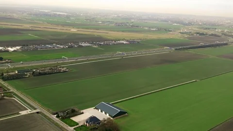 The plane flies over Netherlands on approaching the Schiphol 動画素材 74479209