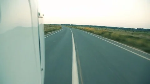 The plane flies over the road. Stock Footage 80312842