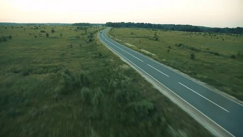 The plane flies over the road. Stock Footage 80312848
