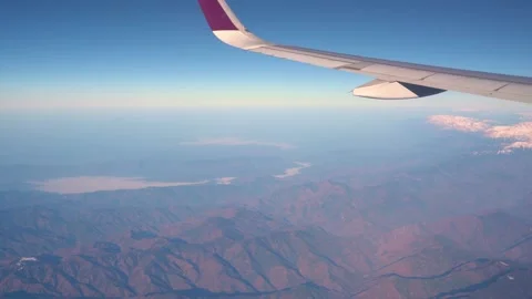 The plane flies over the snowy mountain peaks of the Alps, Leh, India. 動画素材 145963567