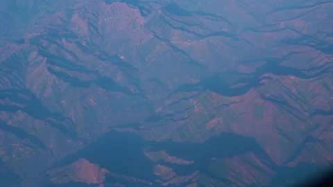 The plane flies over the snowy mountain peaks of the Alps, Leh, India. Видео 145963876