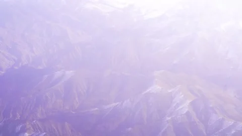 The plane flies over the snowy mountain peaks of the Alps, Leh, India. 動画素材 145964333