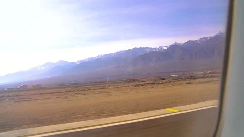 The plane flies over the snowy mountain peaks of the Alps, Leh, India. 動画素材 145964836