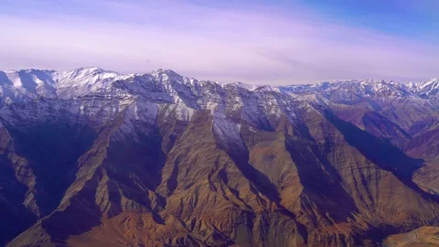 The plane flies over the snowy mountain peaks of the Alps, Leh, India. Stock Footage 145964900