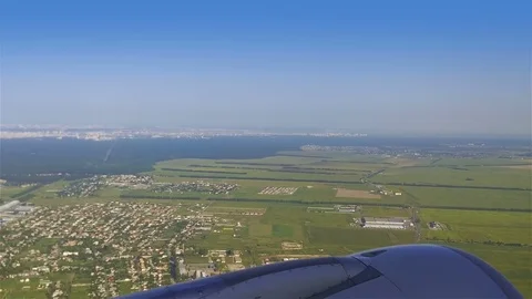 The plane flies over Ukraine on approaching the Kyiv Stock-Footage 79937560
