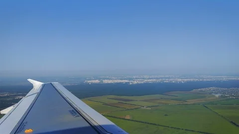 The plane flies over Ukraine on approaching the Kyiv Stock-Footage 79937570