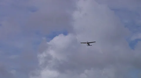 Plane flies overhead, cloudy day Stock Footage 24676333