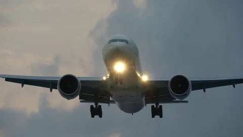 Plane flies overhead before landing. UHD, 4K Stock Footage 83987398